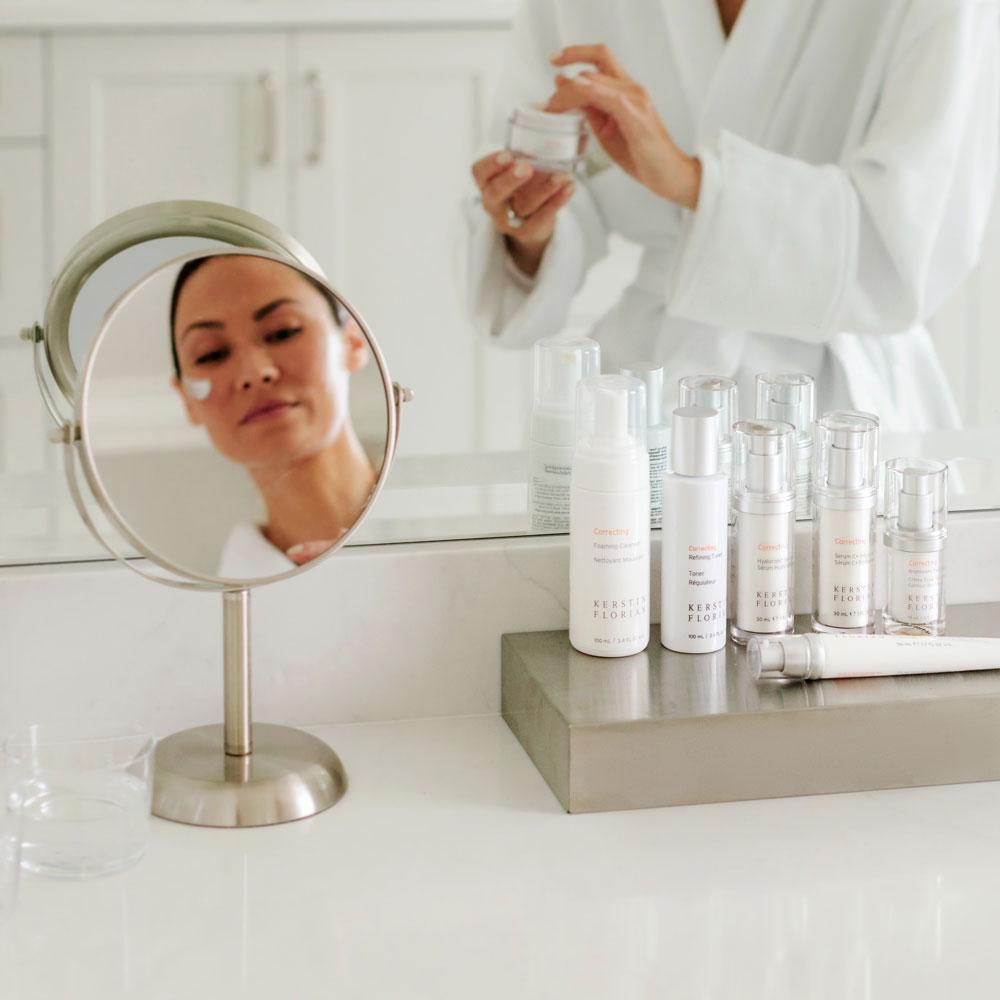Woman in washroom with Kerstin Florian collection