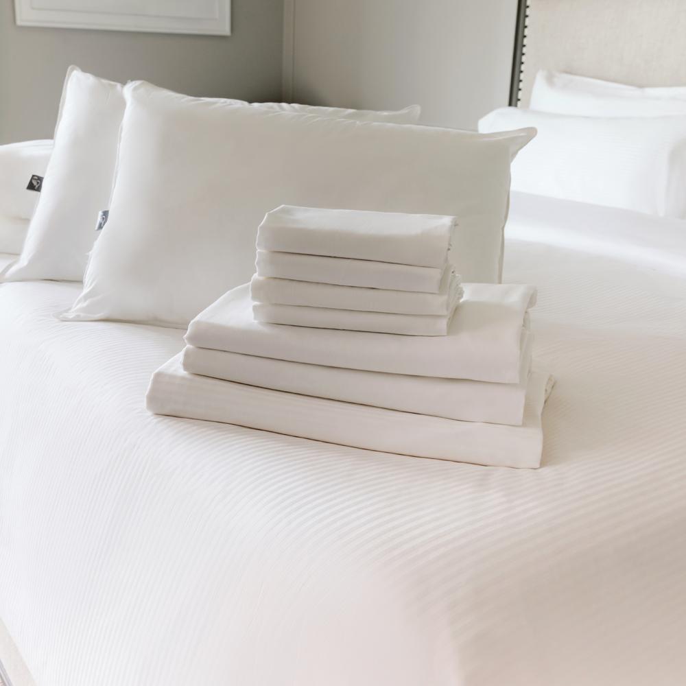 Folded sheet set and pillows on The Fairmont Bed
