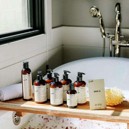 Le Labo Rose 31 collection on tray in bath tub